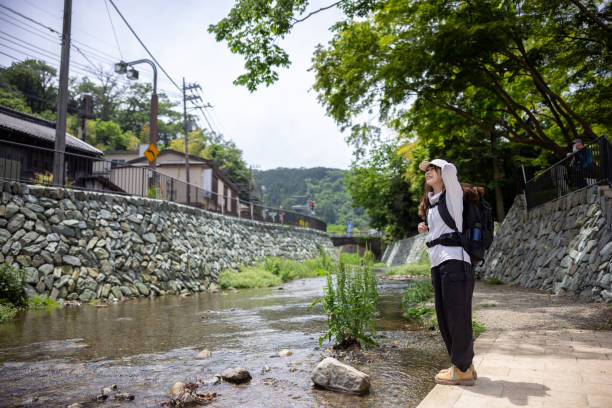 Woman standing by the river