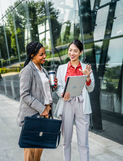 istock Multiracial businesswomen using tablet outdoors 2155002960