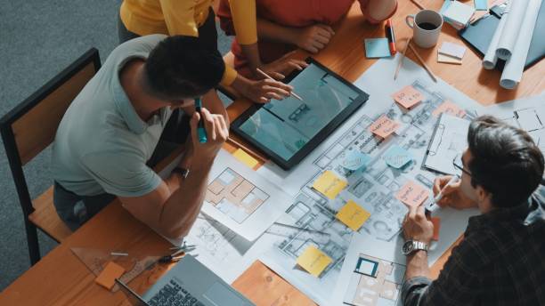 istock Top view of smart team working together to plan house construction. Symposium. 2155005008
