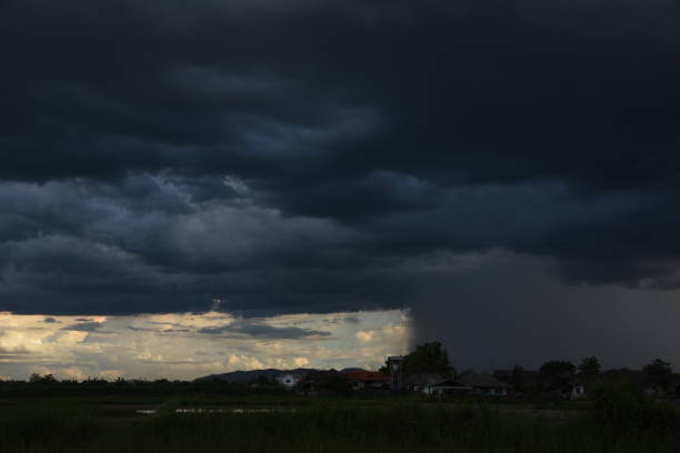 istock Dramatic dark storm rain clouds black sky background. Dark thunderstorm clouds rainny atmosphere. Meteorology danger windstorm disasters climate. Dark cloudscape storm disaster gloomy gray cloud sky 2155005313