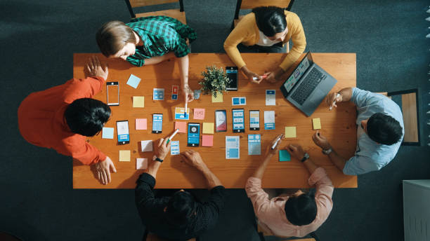 istock Top view of developer and designer shake hand together at meeting. Convocation. 2155007083