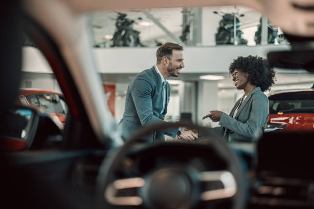 istock Professional dialogue in auto showroom 2155007612