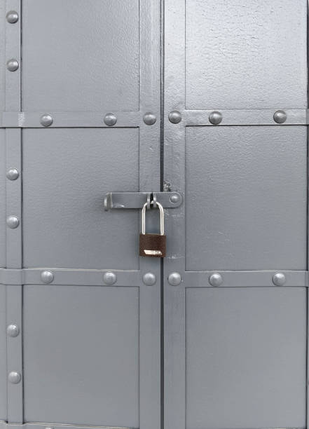 Iron gray door with lock.