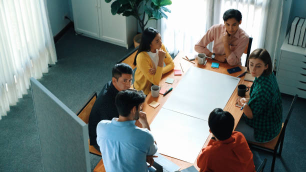 istock Top view of skilled businessman standing and present idea at board. Convocation. 2155010138
