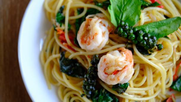 istock Table top view stir-fried spicy spaghetti with shrimp or drunken spaghetti, phad kee mao. 2155012252