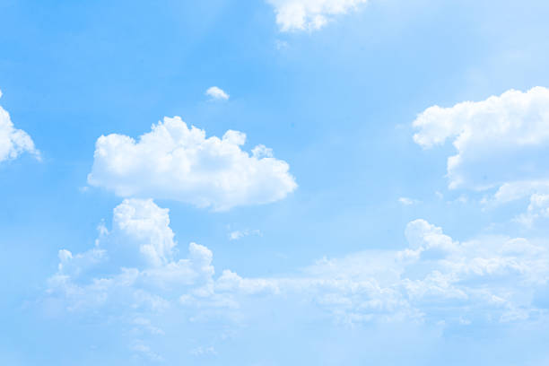 istock A bright blue sky filled with fluffy white clouds on a clear summer day 2155012585
