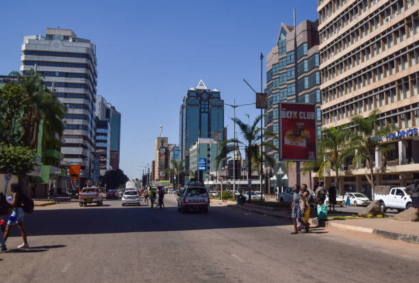 Harare, Zimbabwe - April 20 2024: People walk along Samora Machel Avenue in the city centre, daytime view