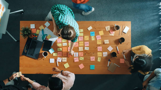 istock Top view of skilled business people discuss plan at meeting room. Convocation. 2155014436