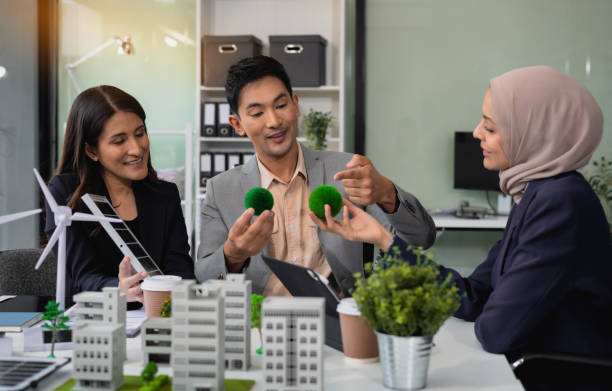 istock Engineer Teamwork Meeting, with partner on model building at company office working technology, Renewable energy-based green businesses and global warming. 2155018812