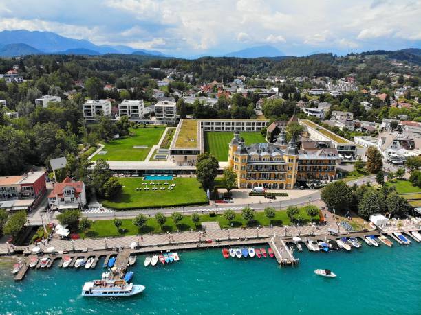 Worthersee mountain lake in Austrian Alps. Austria landscape in State of Carinthia. Town of Velden am Worther See. Drone point of view.