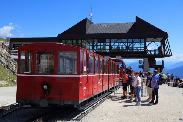 People board the Schafbergbahn steam train to the top of mount Schafberg in Salzkammergut region of Austria. It is a metre gauge cog railway.