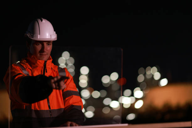 istock White people construction engineer working on tablet inspecting the building project in oil refinery plant at night 2155022492