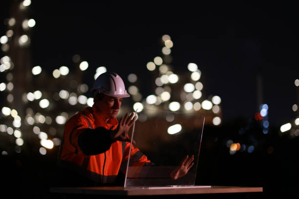 istock White people construction engineer working on tablet inspecting the building project in oil refinery plant at night 2155022495