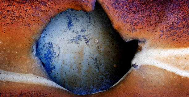 istock Old Rusty Metal with a Hole Damaged 2155024469