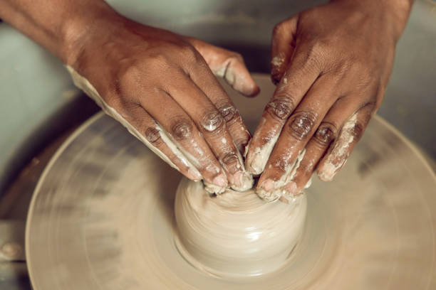 istock Close up of hands on a pottery wheel 2155026448