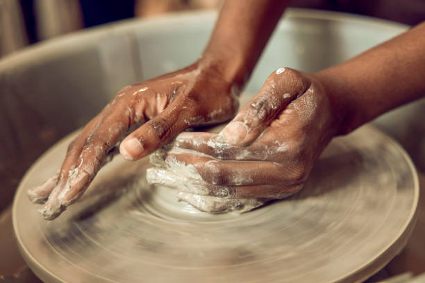 istock Close up of hands on a pottery wheel 2155026457