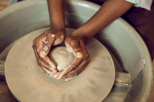 istock Close up of hands on a pottery wheel 2155026466