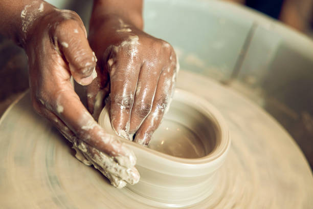 istock Close up of hands on a pottery wheel 2155026482