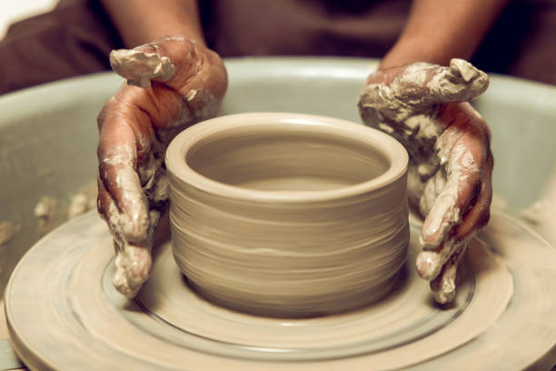 istock Sculptor working with a new product on a pottery wheel 2155026495