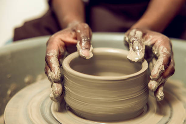 istock Sculptor working with a new product on a pottery wheel 2155026509