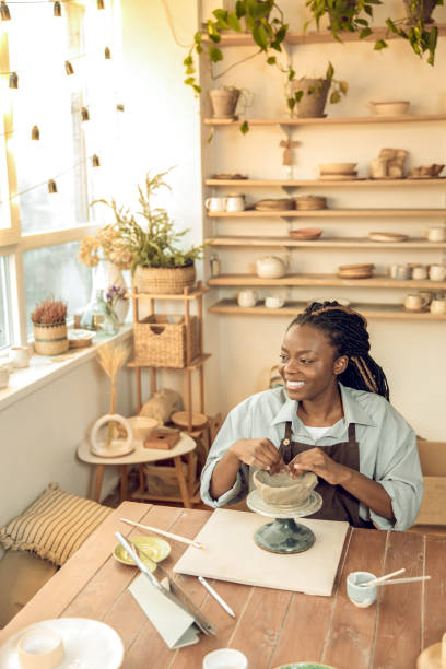 istock Young female sculptor working on new ceramic products 2155026613