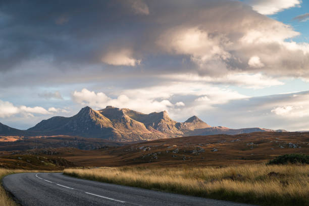 A bright, evening, landscape HDR image of a sunlit Ben Loyal across the Moine in Sutherland, northern Scotland.