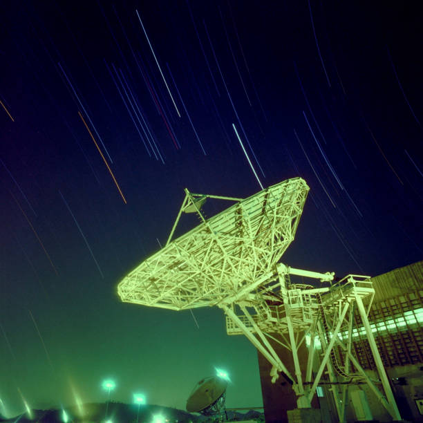 istock Telecommunications satellite dish station at night. 2155029187