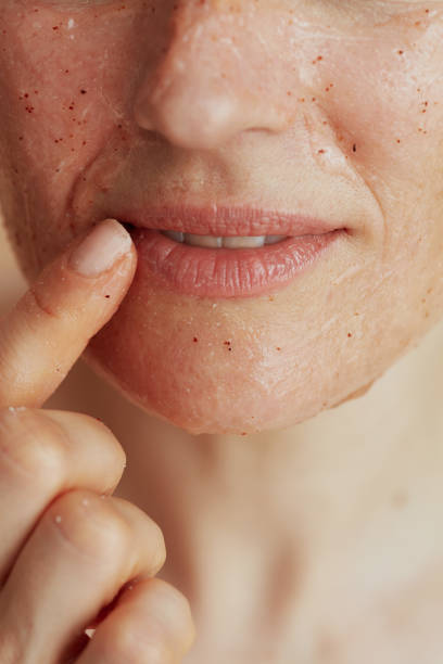 istock Closeup on modern 40 years old woman with face scrub 2155031744