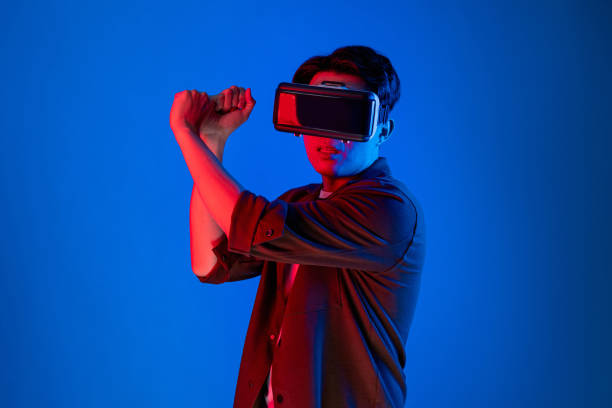 istock Gaming player wearing VR playing golf distance isolated neon blue. Contrivance. 2155033918