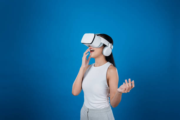 istock Elegant female stand excited seeing virtual scenery in metaverse. Hallucination. 2155034710