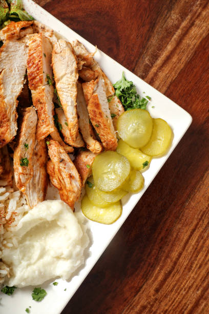 Chicken Shawarma in ceramic plate on wooden table