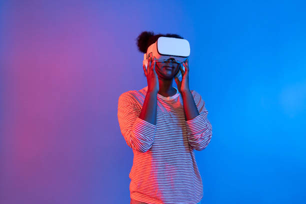 istock Young African woman with VR presentation through meta study online. Contrivance. 2155036489