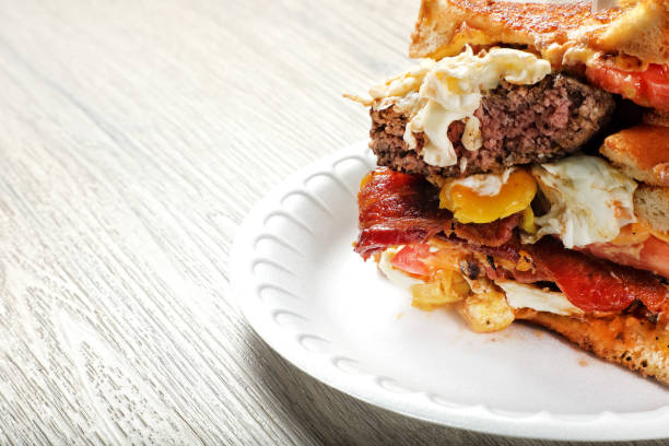 Burger loaded with bacon, fried egg and cheese dish