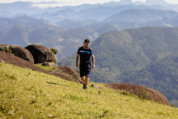 istock Hiker exploring mountain trail: man on an adventurous trek. 2155038491