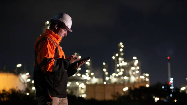 istock White people construction engineer working on tablet inspecting the building project in oil refinery plant at night 2155039526