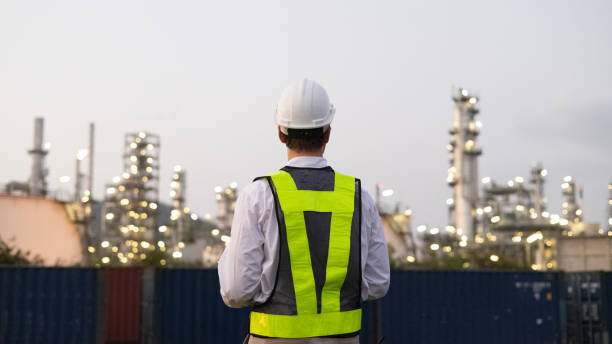 istock White people construction engineer working on tablet inspecting the building project in oil refinery plant at night 2155039615