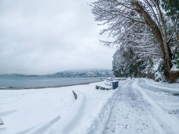 istock Vancouver's seawall at Third Beach covered in snow, displaying a serene white landscape after a heavy snowstorm 2155040352