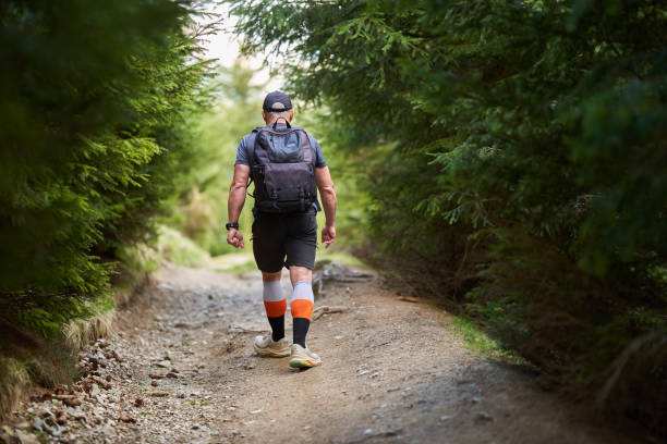 istock Hiker man with backpack in the mountains 2155041502
