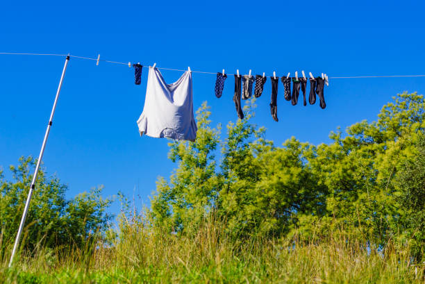 Clothes hanging to dry on laundry line outdoors. Camping on holidays trip
