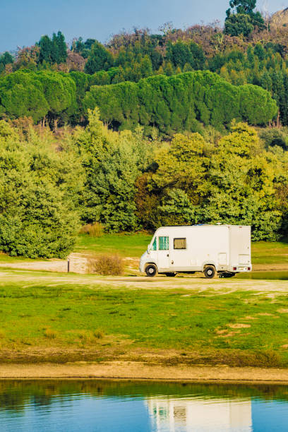 istock Rv caravan on lake shore. Autumn time. 2155042813