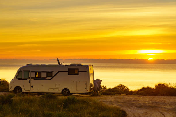 istock Caravan on sea at sunrise. 2155046305