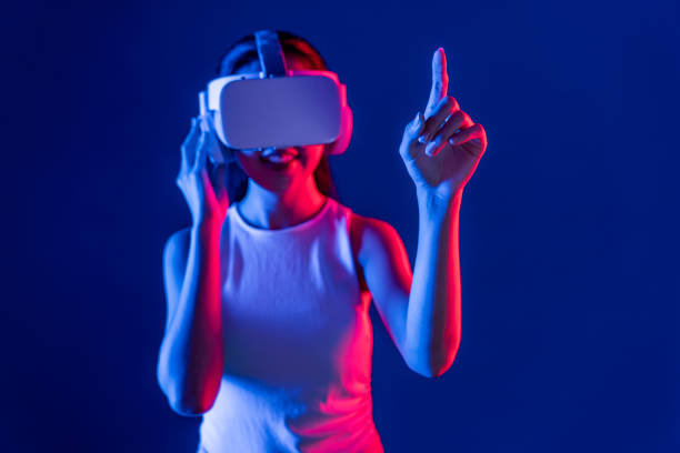 istock Elegant female connect metaverse use finger point virtual object. Hallucination. 2155047101