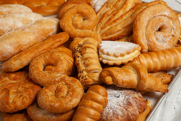 istock Collection of cakes and different pies with cheese, apple, cherry, meat and cabbage on a plate. Bakery goods. Sweet pastries. 2155048667