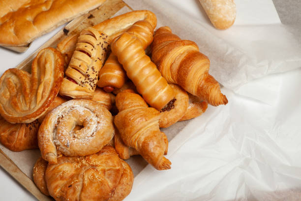 istock Collection of cakes and different pies with cheese, apple, cherry, meat and cabbage on a plate. Bakery goods. Sweet pastries. 2155048705