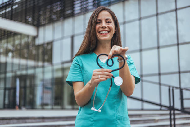 istock Joyful Caucasian Nurse with Stethoscope Heart 2155050541