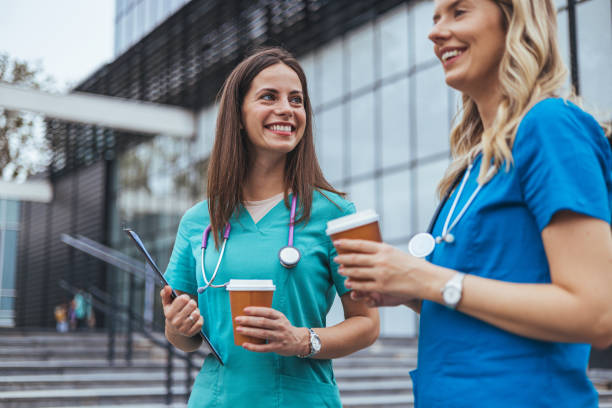 istock Smiling Healthcare Professionals on Coffee Break 2155050689