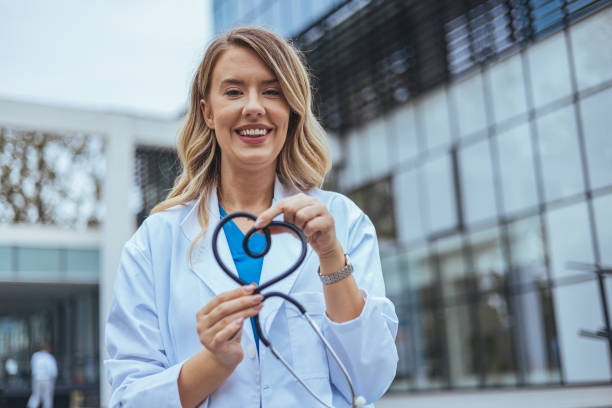 istock Caucasian Female Nurse Showcases Stethoscope 2155050734