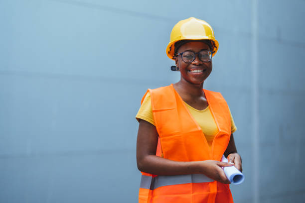 istock Smiling Black Female Construction Worker in Safety Gear 2155051222