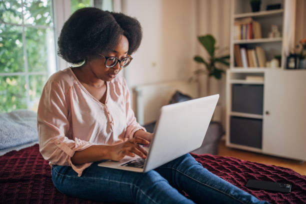 istock Woman using laptop in a comfortable room 2155053558