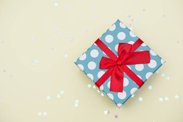 istock Gift box decorated with bright red knotted bow 2155055030